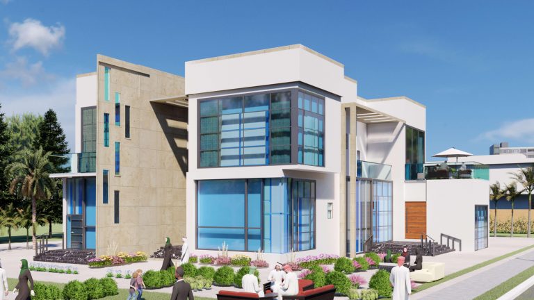 مبنى نهاري مع حديثقة صغيرة أمامه في الزاوية. | A daytime photo of a building with a small garden in front.